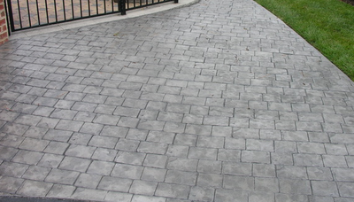 Cobblestone patterned concrete driveway.