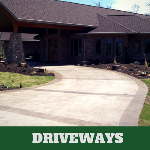 Two toned colored concrete driveway in Elkhart, IN with brick home.