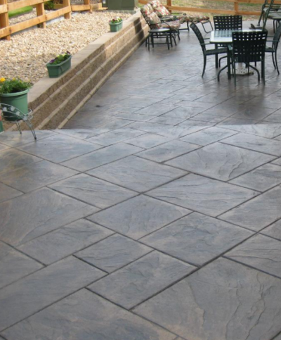 Concrete front porch with tile stamped stained concrete