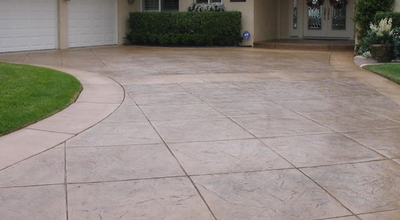 Concrete cutting done beautifully in a stamped concrete driveway.