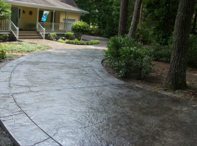 Perfectly curved cut, stamped and stained concrete.