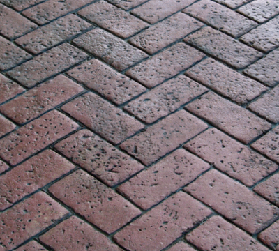 Brick patterned stained and stamped concrete sample.