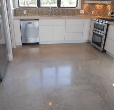 Interior kitchen floor done with polished and acid washed concrete.