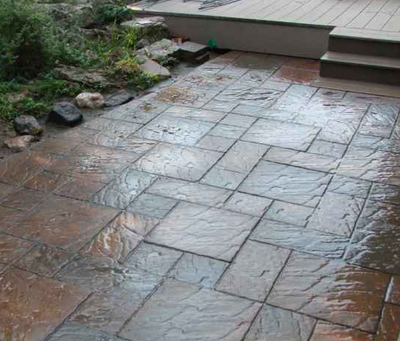 Brick styled stamped concrete patio.